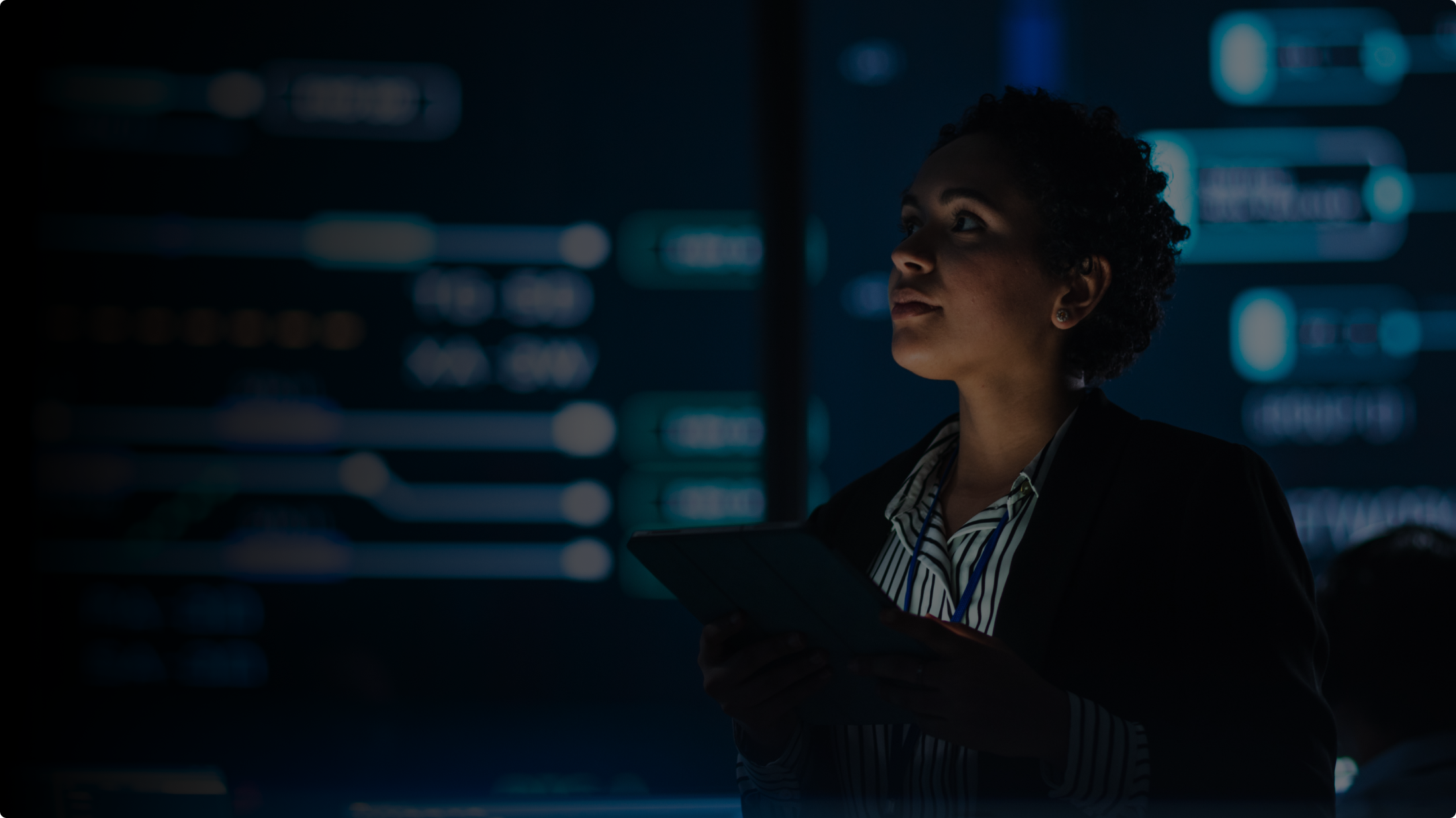 Businesswoman reviewing datastreams